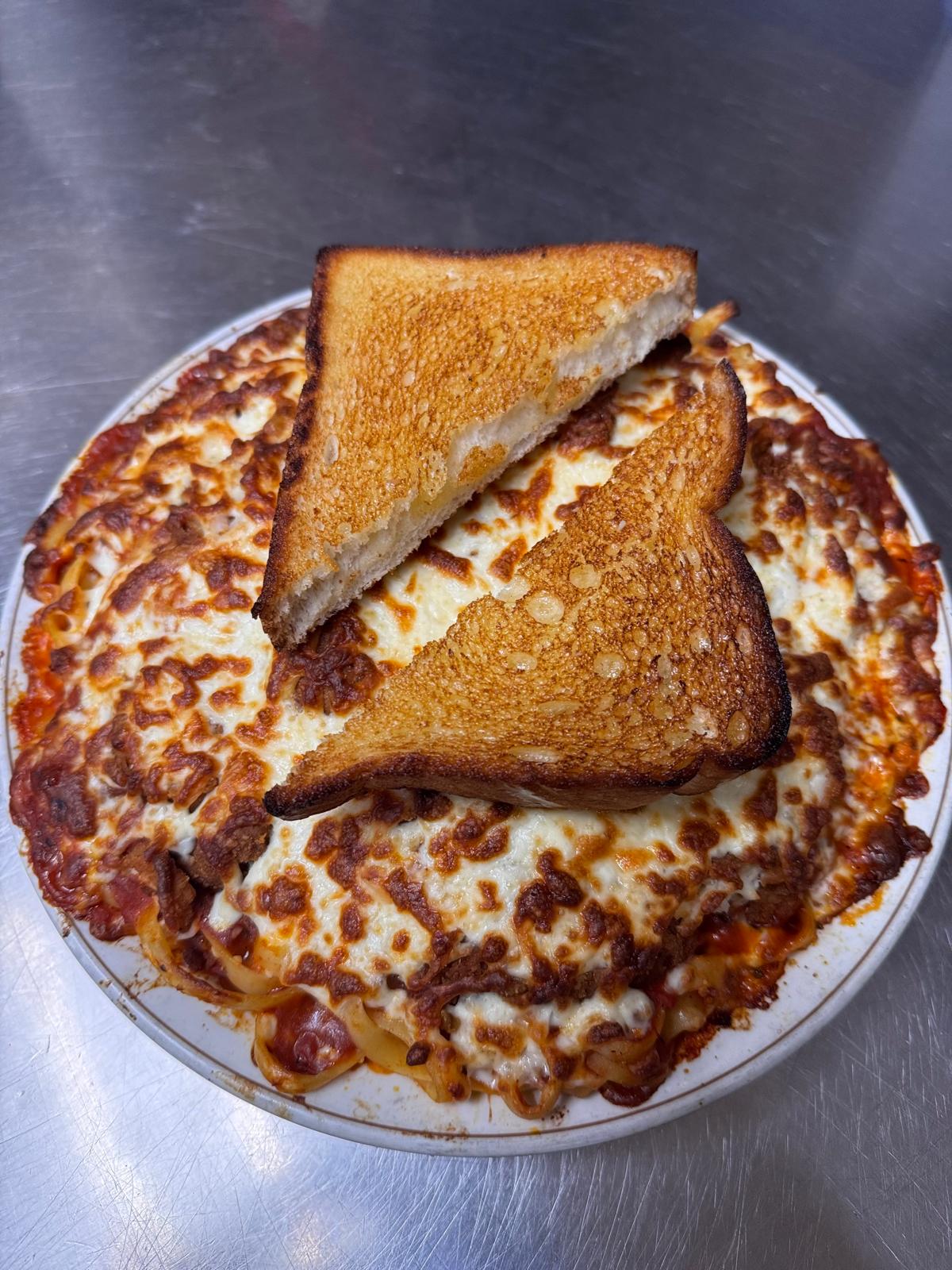 Penne Ala De Pappa at Pappa's Family Restaurant & Lounge Edmonton - specialty pasta with ham, mushroom, and salami